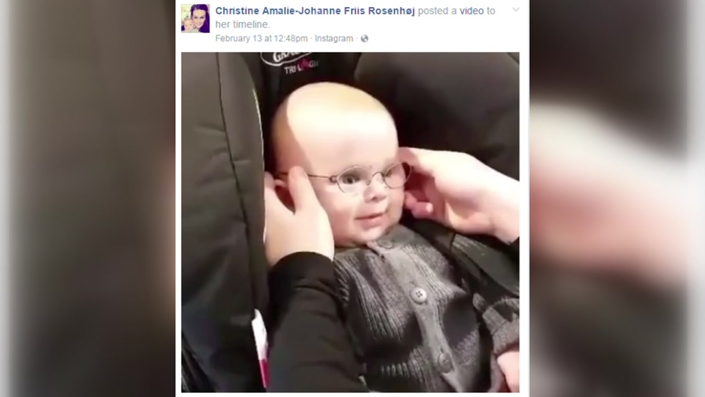 Baby giggles after seeing parents clearly for first time with new glasses